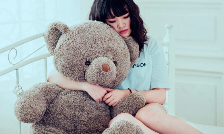 Girl caring teddy