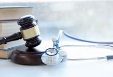 Gavel and stethoscope. medical jurisprudence. legal definition of medical malpractice. attorney. common errors doctors, nurses and hospitals make