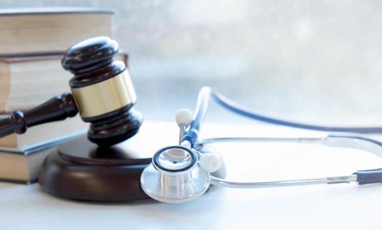 Gavel and stethoscope. medical jurisprudence. legal definition of medical malpractice. attorney. common errors doctors, nurses and hospitals make