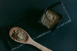 Brown Wooden Spoon on Black Wooden table