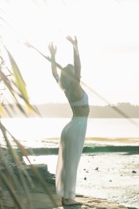 a woman stretching, maintaing health with cbd products