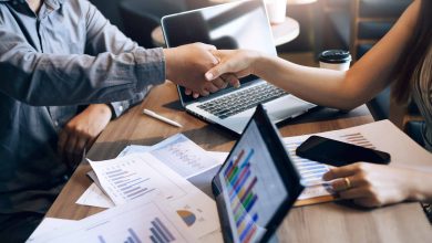 A dynamic team of marketing professionals strategizing around a conference table, surrounded by digital marketing metrics and creative concepts.